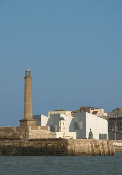 Mrs Booth on the Margate Pier silhouetted against the Turner Contemporary (Shell lady sculpture by Ann Carrington)